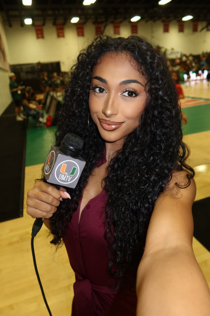 Jaya reporting courtside with UMTV mic